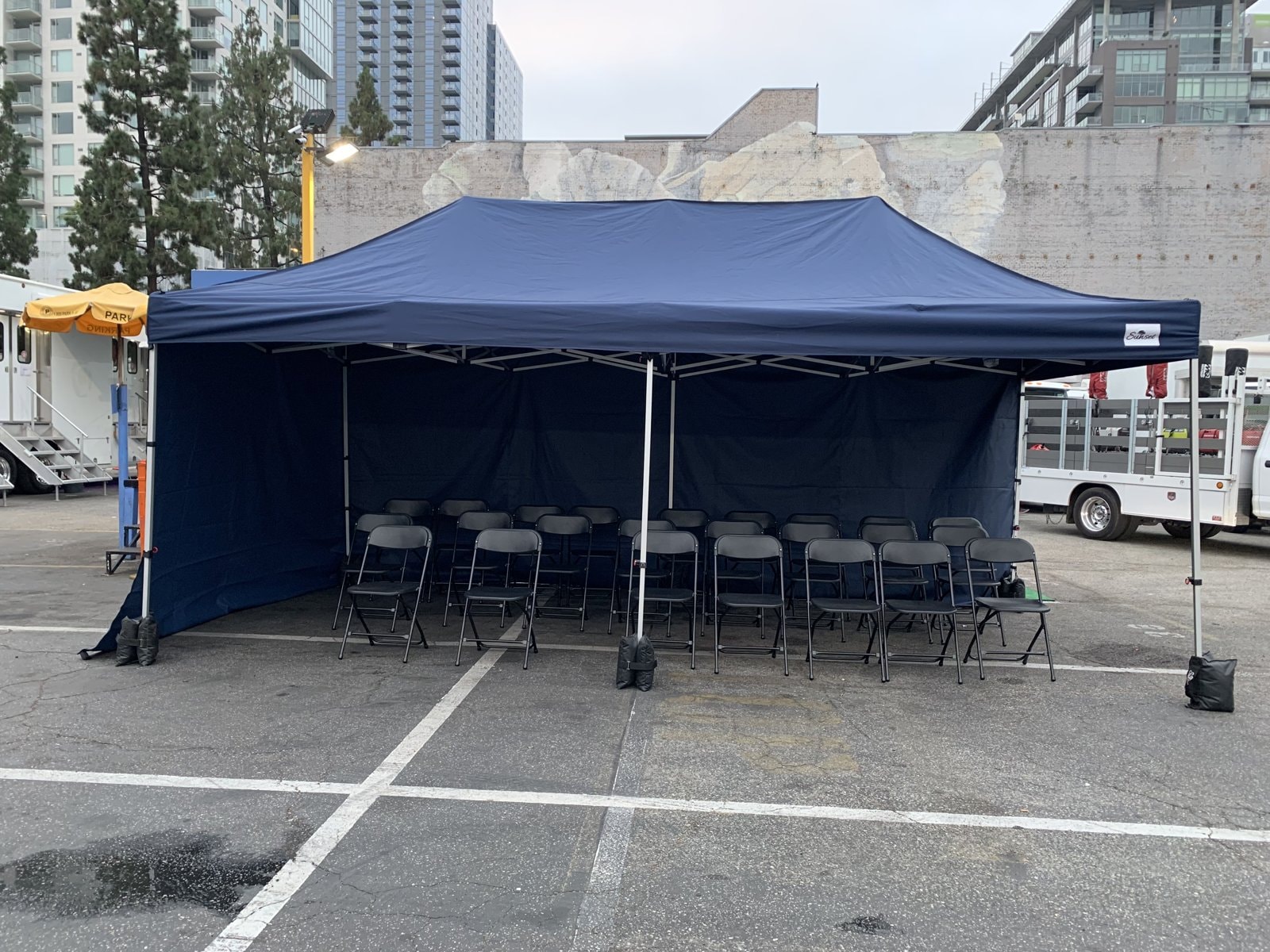 Navy tent background holding area on location